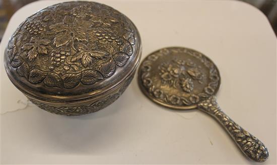 Chinese silver hand mirror, cast floral decoration, stamped 90 & a vineous embossed silver [800] circular box & cover(-)